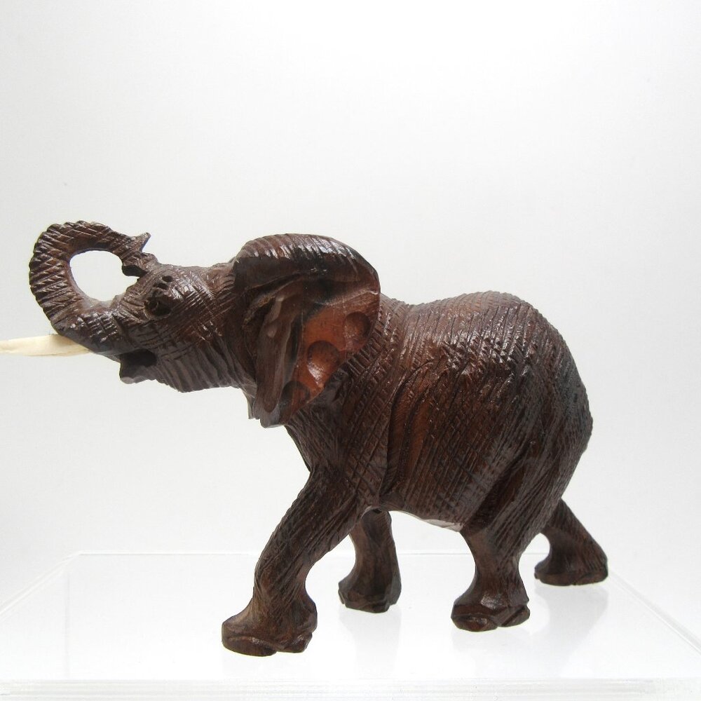 Vintage raised trunk resin elephant with tusks - brown textured faux wood - 3"